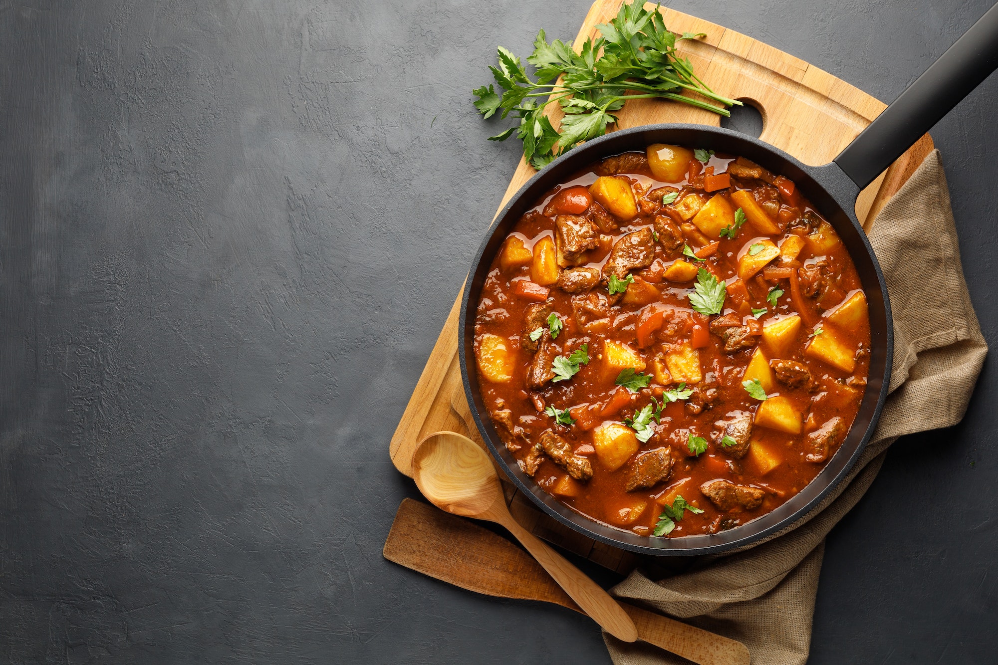 Goulash, beef stew with vegetables in tomato sauce