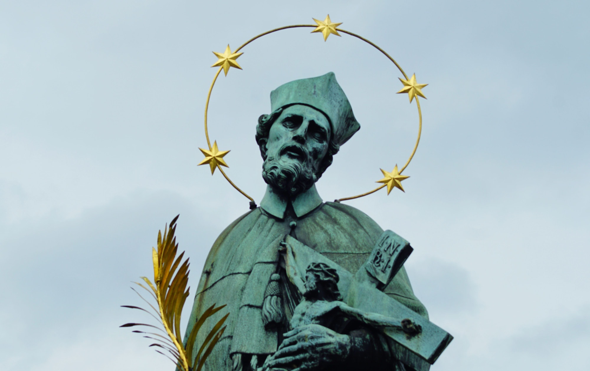 Statue of John of Nepomuk on the north side of the Charles Bridge in Prague, Czech Republic.